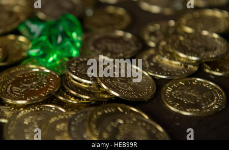 Fake doubloons and jewels are laid on a table as props during the 86th Force Support Squadron Vogelweh Community Center’s Port Royal Mystery Escape Room on June 21, 2016, at Vogelweh Military Complex, Germany. The escape room is a pirate-themed event where participants have one hour to solve riddles and puzzles to get out of a room. It is catered towards single Airman, squadrons and units, but is open to anyone who is authorized to use Air Force Morale, Welfare and Recreation programs. Airman 1st Class Tryphena Mayhugh) Stock Photo