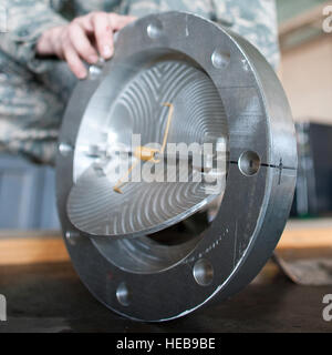 YOKOTA AIR BASE, Japan -- Airman 1st Class Jeremy Hamblin, 374th Maintenance Squadron, delivers a component parts for a water pump at Yokota Air Base, March 27, 2011 after working for it 20 hours. These components will be delivering to Australian engineers that pass them to Japanese relief workers who can use the newly created flanges to help cool down the nuclear reactors and help stabilize the Fukushima Daiichi nuclear power plant. Osakabe Yasuo) Stock Photo