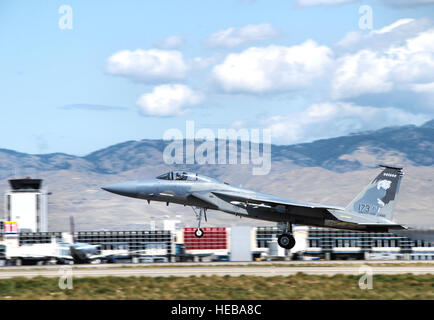 An F-15 Eagle from the 173rd Fighter Wing, Ore. Air National Guard, takes off down the runway for a routine training mission at Gowen Field, Boise, Idaho during Sentry Displacement.  The 173rd Fighter Wing is temporarily relocated to Gowen Field while the runway at their  home base in Klamath Falls is being repaired. Stock Photo