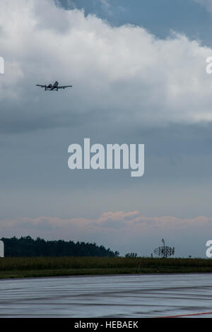 A U.S. Air Force A-10 Thunderbolt II attack aircraft pilot assigned to the 354th Expeditionary Fighter Squadrontakes off from the runway during a theater security package deployment at Lask Air Base, Poland, July 9, 2015. U.S. Air Force Airmen conduct training alongside NATO allies to strengthen interoperability and demonstrate U.S. commitment to the security and stability of Europe.  Staff Sgt. Christopher Ruano Stock Photo