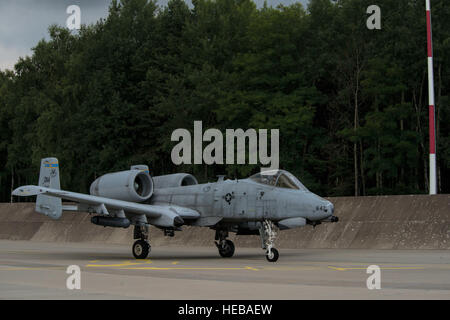 A U.S. Air Force A-10 Thunderbolt II aircraft assigned to the 354th Expeditionary Fighter Squadron taxis on the runway during a theater security package deployment to Lask Air Base, Poland, July 13, 2015. U.S. Airmen conduct training alongside NATO allies to strengthen interoperability and demonstrate U.S. commitment to the security and stability of Europe.  Staff Sgt. Christopher Ruano Stock Photo