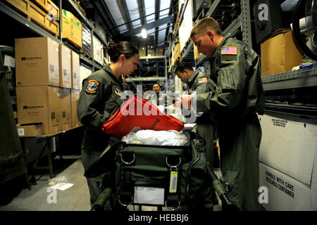 Aeromedical Evacuation members prepare and inspect medical supplies during a national disaster exercise, Ultimate Caduceus 2014, at Cheyenne Air National Guard Base, Wyo., March 30, 2014. During Ultimate Caduceus, part of the Federal Emergency Management Agency's National Capstone Exercise, AE members provided medical support processed and transferred patients. The aeromedical teams were comprised of more than 18 AE crew members from Pope Army Airfield, N.C., Scott AFB, Ill., and Cheyenne ANG Base, Wyo.  Staff Sgt. Stephenie Wade) Stock Photo