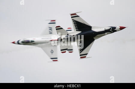 Maj. Blaine Jones, Thunderbird 5, Lead Solo and Maj. Jason Curtis, Thunderbird 6, Opposing Solo, perform the Inverted Opposing Knife-Edge Pass, during Rockford AirFest at Chicago Rockford International Airport, June 8, 2014. (U.S. Air Force photo/Master Sgt. Stan Parker) Stock Photo