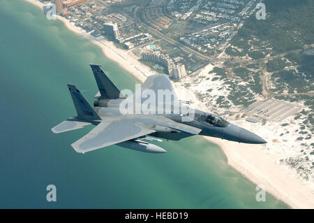 An F-15 crosses Pannama City Beah on approch to Tyndall AFB after a mission over the Gulf of Mexico supporting the Weapons Systems Evaluation Program. Members of the 125th Fighter Wing, Florida Air National Guard and 144 Fighter Wing, California Air National Guard participate in the weapons Systems Evaluation Program (WSEP) at Tyndall Air Force Base Fl.  The units teamed up with the 53 Weapons Evaluation Group  to 'live fire' weapons from there F-15 Eagles and F-16 Vipers to test the peramiters of the weapons in relation to their aircraft. (U.S. Air Force photo by MSgt Shaun Withers) Released Stock Photo