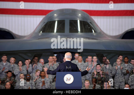 With a B-2 Spirit bomber in the background, Vice President Joe Biden speaks to the troops at Whiteman Air Force Base, Mo., April 16 to show the administration's support for the troops. Mr. Biden later visited Jefferson City and the University of Missouri-St. Louis to highlight progress of the Recovery Act. (U.S. Air Force photo/Senior Airman Jason Huddleston) Stock Photo