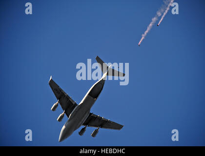 U.S. Air Force Academy parachute team “Wings of Blue” jump from a C-17 Globemaster III aircraft over Joseph P. Riley Jr. Park, home to the Charleston Riverdogs baseball team, Charleston, S.C., June 18, 2012.  Wings of Blue will be performing during the opening ceremonies of the 2012 South Atlantic League All Star Game on June 19, 2012.  (U.S. Air Force photo by Tech. Sgt. Tony R. Tolley/Released) Stock Photo