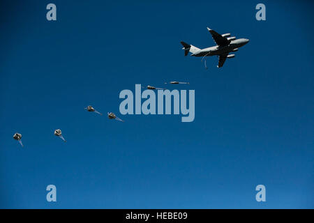 Army combat engineers with U.S. Army Alaska jump out of a an Air Force C-17 Globemaster III into Allen Army Airfield at Fort Greely, Alaska, as part of exercise Northern Edge June 17, 2015. Northern Edge is Alaska’s premier joint training exercise designed to practice operations, techniques and procedures, as well as enhance interoperability among the services. Thousands of Airmen, Soldiers, Sailors, Marines and Coast Guardsmen from active-duty, Reserve and National Guard units were involved. (U.S. Marine Corps photo/Cpl. Tyler S. Giguere) Stock Photo