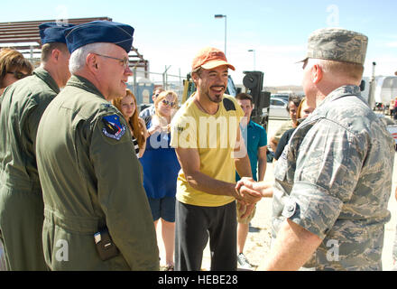 Robert Downey Jr., star of Ironman II shakes hands with Col. Jerry Gandy, 95th Air Base Wing commander, during a break in filming here, May 13. About 60 members of Team Edwards participated in the filming as extras and technical advisors. (Air Force photo/Mike Cassidy) Stock Photo