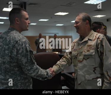 U.S. Navy Adm. Edmund P. Giambastiani, vice chairman of the Joint Chiefs of Staff, meets with U.S. Army Sgt. David Griffin, 1st Cavalry artillery non-commissioned officer, during a visit to Camp Liberty in Baghdad, Iraq, June 20. Giambastiani visited troops in Iraq to find out about operations, thank troops for their service and to find out if they had all the tools they needed to do their job. Stock Photo