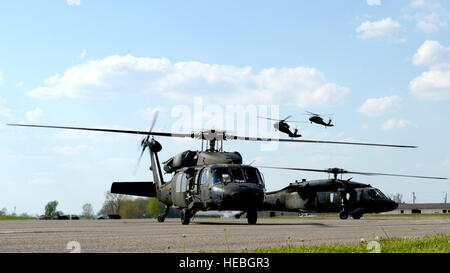 Members from the 1st Combat Aviation Brigade, 1st Infantry Division, Fort Riley, Kan., including Brigade Commander, Col. Matthew R. Lewis, arrived from Fort Riley in six UH-60 Black Hawks May 2 to support Exercise Vibrant Response 15, a 616-member Defense Chemical, Biological, Radiological, Nuclear Response Force command post exercise, at Camp Atterbury, Ind. The exercise tests the capabilities of the federal response to meet the expectations of the nation. It provides realistic training to prepare CBRN response units to integrate with civilian partners and respond to natural or man-made catas Stock Photo