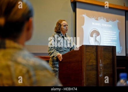 Lt. Col. Sirena Morris addresses women and men attending the Women's Equality Day celebration at the 379th Air Expeditionary Wing in Southwest Asia, Aug. 26, 2013. The colonel's words and many others quoted during the event served as mentoring points and notes of motivation. Morris is the 379th Expeditionary Force Support Squadron commander and a Fayetteville, N.C., native. (U.S. Air Force photo/Senior Airman Benjamin Stratton) Stock Photo