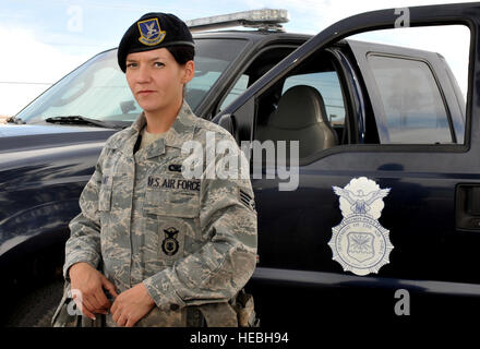 U.S. Air Force Senior Airman Cynthia Bryant, 99th Security Forces Squadron security response leader, stands in front of her military vehicle March 23, 2012, at Nellis Air Force Base, Nev. Bryant maintains security of Air Force resources around the installation from sabotage, espionage, subversion and attack.  (U.S. Air Force photo by Airman 1st Class Daniel Hughes) Stock Photo