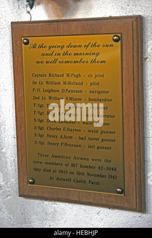 A plaque hangs on the wall inside the Parish Church of St. Mary Magdalene in memorial to a B-17 air crew killed when their plane crashed at Astwell Castle Farms in 1943. Members of the 422nd Air Base Group and local villages held a memorial service in the Parish Church of St. Mary Magdalene in Helmdon Nov. 2 to honor the airmen killed. (U.S. Air Force photo by Staff Sgt. Brian Stives) Stock Photo