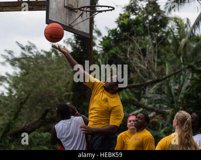 ARAWA, Autonomous Region of Bougainville, Papua New Guinea (July 3, 2015) Sailors from the hospital ship USNS Mercy (T-AH 19) play volleyball with students during Pacific Partnership 2015. Sailors visited the Arawa Secondary School to play basketball and volleyball with students as part of a community relation’s event during PP15. Mercy is in Papua New Guinea for its second mission port of PP15. Pacific Partnership is in its 10th iteration and is the largest annual multilateral humanitarian assistance and disaster relief preparedness mission conducted in the Indo-Asia-Pacific region. While tra Stock Photo