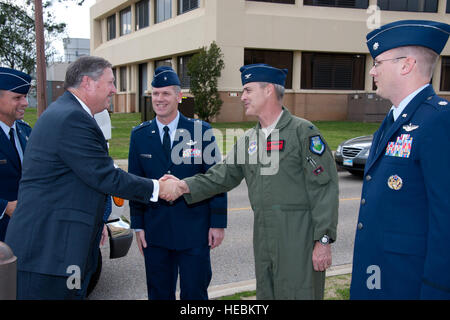 Secretary of the Air Force Michael B. Donley is greeted by Air Command & Staff College Commandant Brig. Gen. Stephen Denker, Squadron Officer College Commandant Col.l Terrence McCaffrey and AY12 School of Advanced Air & Space Studies student Lt. Col.  Michael Curry on February 23, 2012.  The SECAF was at Squadron Officer College at Maxwell Air Force Base to speak and answer questions during a session with students from Air War College and Air Command and Staff College. (Also pictured, far left, is Maj Gen Scott Hanson, AWC Commandant.(US Air Force photo by Melanie Rodgers Cox/released) Stock Photo
