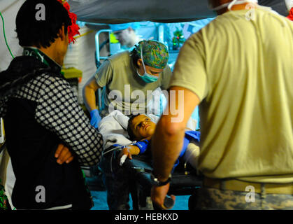 Hamed, a five year-old Afghan boy is transported to the operating room by members of the 541st Forward Surgical Team at Camp Pannonia, Afghanistan, Dec. 19. The 541st FST has ten members in Pol-e Khumri and provide life saving surgical and resuscitative care to the region. Stock Photo