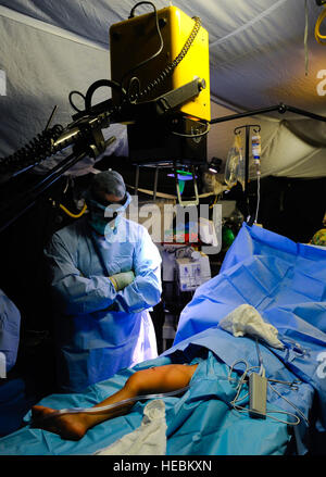 The 541st Forward Surgical Team provided surgical and resuscitative care, including an X-ray for a pediatric patient at Camp Pannonia, Afghanistan, on December 19, supporting regional medical operations with ten personnel in Pol-e Khumri. Stock Photo