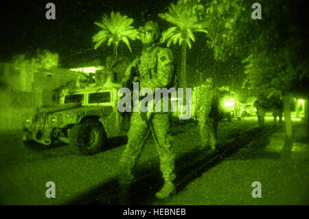 U.S. Army Soldiers, assigned to 2nd Platoon, Delta Company, 2nd Combined Arms Battalion, 69th Armor Regiment, Fort Benning, Ga., patrol Al Jadida, Baghdad, Iraq, Jan. 15, 2008. The presence patrols are designed to discourage enemy activity at night. The objective of this patrol was to provide cover for a sniper kill team while they moved out of position. (U.S. Air Force Photo/Staff Sgt. Jason T. Bailey) Stock Photo