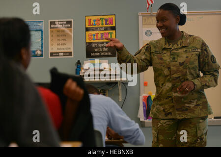 U.S. Army personnel participate in a career day at Booker T. Washington Middle School in Newport News, Virginia, engaging students as part of outreach and education initiatives on April 1, 2016. Stock Photo