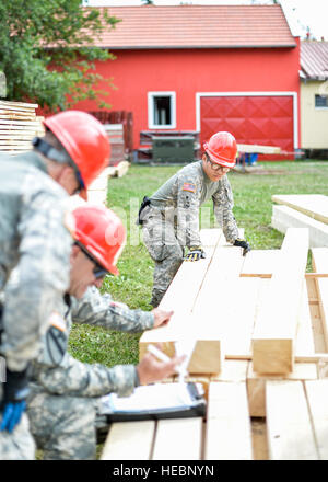 Spc. Blong Kong, carpentry/masonry specialist, 851st Vertical Engineer Company, helps with lumber inventory prior to the start of a humanitarian civic assistance project June 19, 2015. Spc. Kong, a native of East St. Paul, Minn., and other members of the Minnesota Army National Guards 851st Vertical Engineer Company are currently deployed to Croatia to work alongside members from the Croatian Army, Armored Mechanized Brigade to renovate a village community center after it was severely damaged by flooding last year. The project was made possible by the Minnesota State Partnership with Croatian, Stock Photo