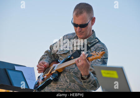Master Sgt. Gary Noel, member of the Air Forces Central Command Band Afterburner, performs a holiday songs at the 26th Expeditionary Rescue Squadron at Kandahar Airfield, Afghanistan, Dec. 24, 2011. Noel and the rest of the band is deployed from Hanscom Air Force Base, Mass. Stock Photo