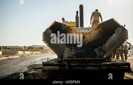 Airmen from the 557th Expeditionary RED HORSE Squadron repave roads at ...
