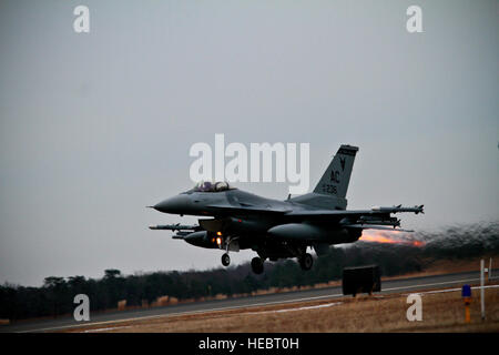 A U.S. Air Force F-16C Fighting Falcon from the New Jersey Air National Guard's 177th Fighter Wing takes off from Atlantic City International Airport, N.J., Jan. 28 during an intercept exercise involving the Civil Air Patrol in preparation for Super Bowl XLVIII. U.S. Air Force assets will be part of a joint team involving the FBI, Customs and Border Protection, Civil Air Patrol and the FAA providing security for the Super Bowl in the air.  (U.S. Air National Guard photo by Tech. Sgt. Matt Hecht/Released) Stock Photo