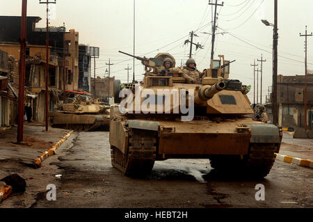 060203-F-7823A-008  U.S. Army M1 Abrams tanks maneuver in the streets as they conduct a combat patrol in the city of Tall Afar, Iraq, on Feb. 3, 2005.  The tanks and their crews are attached to the 3rd Armored Cavalry Regiment.  DoD photo By Staff Sgt. Aaron Allmon, U.S. Air Force.  (Released) Stock Photo