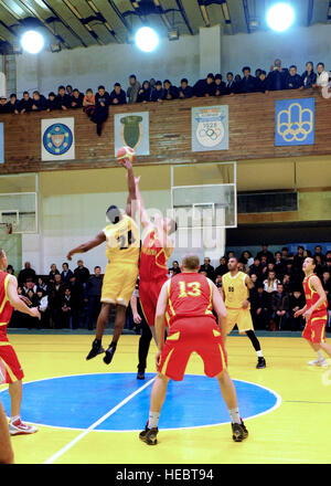 U.S. Air Force Staff Sgt. Eric Miles, 376th Expeditionary Logistics Squadron vehicle operator, goes up for the tip-off against a player for the Krygyz National Team during a first-round game of the international basketball tournament between the Transit Center at Manas and the Kyrgyz National team at the Palace of Sport in Bishkek, Kyrgyzstan, March 18. Seven teams played in the six-day tournament. The countries participating include Kyrgyzstan, Kazakhstan, Uzbekistan, Turkmenistan, Aizerbaidzhan Soviet Socialist Republic, and two teams representing the U.S. (U.S. Air Force photo/Senior Airman Stock Photo