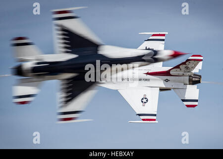 Majs. Blaine Jones, Thunderbird 5, Lead Solo and Jason Curtis, Thunderbird 6, opposing solo, perform the Inverted Opposing Knife-Edge Pass during their practice performance at the Wings of Freedom Open House and Air Show, Altus Air Force Base, Okla., Sept. 13, 2014. (U.S. Air Force photo/Master Sgt. Stan Parker) Stock Photo