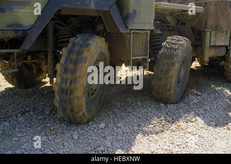 A left side close-up view of the multi-wheel steering system on the tractor portion of a ground-launched cruise missile transporter-erector-launcher (TEL).  The TEL is assigned to the 501st Tactical Missile Wing. Stock Photo