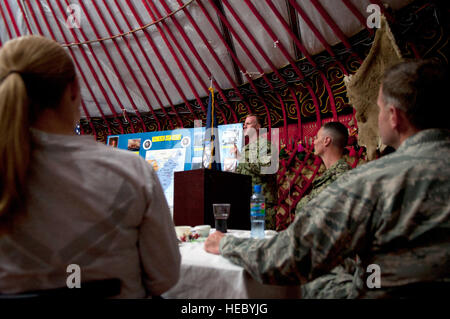 Lt. Cmdr. Thomas Fries, operations officer for U.S. Navy Forces Central Command, told stories about the history of the Navy during the service branch's 238th birthday celebration at Transit Center at Manas, Kyrgyzstan, Oct. 13, 2013. Fries is deployed out of Joint Expeditionary Base Little Creek-Fort Story, Va, and is a native of Annapolis, Md. (U.S. Air Force photo/Staff Sgt. Robert Barnett) Stock Photo