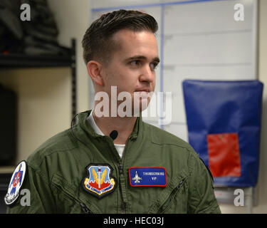 Brendan Lyons, Tucson community hometown hero, listens to a briefing about the aircrew flight equipment he will be using during a flight in a U.S. Air Force Air Demonstration Squadron Thunderbird, an F-16 Fighting Falcon, at Davis-Monthan Air Force Base, Ariz., March 11, 2016.  Lyons was nominated as a hometown hero because of his commitment to safety and his passion to make Tucson a safer community for cyclists and motorists. (U.S. Air Force photo by Senior Airman Chris Massey/Released) Stock Photo