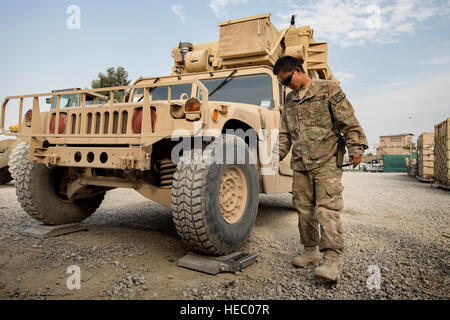 Senior Airman Leah Johnson, 19th Movement Control Team aerial porter, checks the weight of a vehicle scheduled for shipping at Forward Operating Base Salerno, Khost province, Afghanistan, Sept. 22, 2013. The 19th MCT, a small squadron of Air Force surface movement controllers and aerial porters, have the herculean task of overseeing the vast majority of retrograde operations at FOB Salerno. Johnson, a St. Paul, Minn. native, is deployed from Travis Air Force Base, Calif. (USAF Photo/Master Sgt. Ben Bloker) Stock Photo