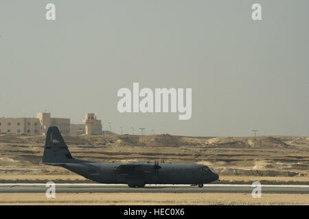 An U.S. Air Force C130J Super Hercules with the 737th Expeditionary Airlift Squadron in Southwest Asia arrived at Sakhir Airbase in Manama, Bahrain, to participate in the 2014 Bahrain International Air Show, Jan. 14, 2014. The C130J and crew are deployed from the 143rd Airlift Wing, Rhode Island Air National Guard. The BIAS is scheduled to begin Jan. 16 and continue through Jan. 18. The U.S. will support several aviation static displays. The U.S. is showcasing the C-130J Hercules, F-15E Strike Eagle, F-18E/F Hornet, MV-22 Osprey, and UH-1Y Huey Venom, AH-1Z Viper and MH-53E Sea Dragon helicopt Stock Photo