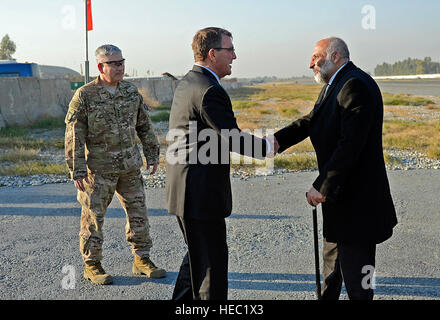 General John Campbell and U.S. Defense Secretary Ash Carter greet Afghanistan Defense Minister Mohammed Masoom Stanekzai at his arrival to Forward Operating Base Fenty – Jalalabad, Afghanistan. Stock Photo