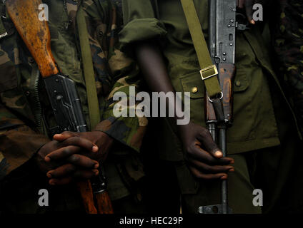 Uganda Army soldiers stand in formation before being released to begin their land navigation course taught to them by U.S. Army Soldiers from 3rd Platoon, Delta Company, 1st Battalion, 3rd Infantry Regiment, The Old Guard, Fort Myers, Virginia, on February 13, 2008 at Forward Operating Location Kasenyi, Uganda. The Ugandan Soldiers are given a compass and a map and are then expected to go out and find five markers in the field. Soldiers from The Old Guard are tasked with training the Ugandan Soldiers during a 16 week Military to Military training school located at Forward Operating Location Ka Stock Photo