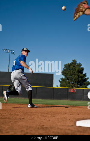 David Baska, U.S. Air Force Academy 'Falcons' sophomore, tosses a ball into the glove of the second baseman during infield practice before a game against the University of Nevada, Las Vegas 'Rebels',  April 20, 2012, at Earl E. Wilson Stadium, in Las Vegas, Nev. Baska is also the punter for the Air Force Academy's football team. Stock Photo