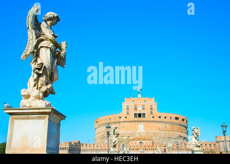 St. Angelo castle with statues on St. Angels bridge on foreground. Rome, Italy Stock Photo