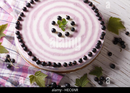 Round striped currant cheesecake close-up on the table. horizontal Stock Photo