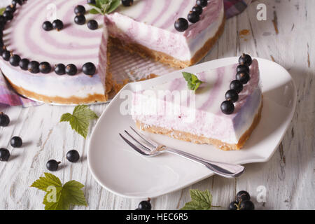 Beautiful piece of currant cheesecake close-up on a plate. horizontal Stock Photo