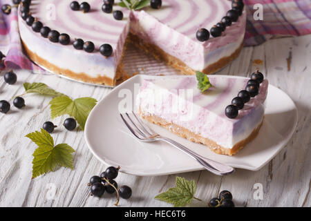 Beautiful sliced currant cheesecake close-up on a plate. horizontal Stock Photo