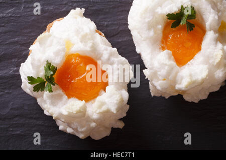 Eggs Orsini: baked whipped whites and yolks on a table close-up. horizontal view from above Stock Photo