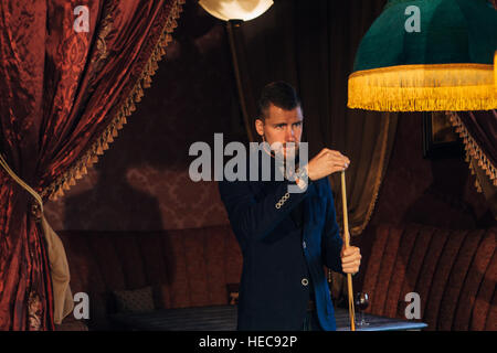 handsome serious man playing pool Stock Photo
