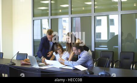 colleagues are actively discussing the business plan Stock Photo
