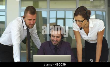 smiling young call center agents at work Stock Photo