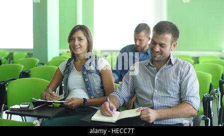 group of students sitting at the lecture in the classroom Stock Photo