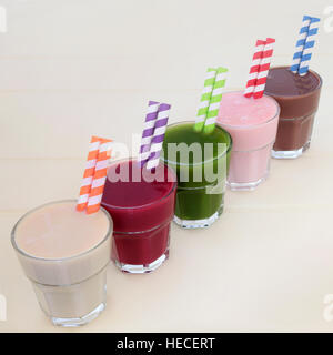 Health food drinks of maca root, pomegranate fruit, wheat grass, acai berry and chocolate whey. Also used by body builders. Stock Photo