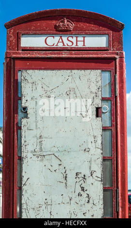 Abandoned, boarded up British telephone box , now in decline. Stock Photo