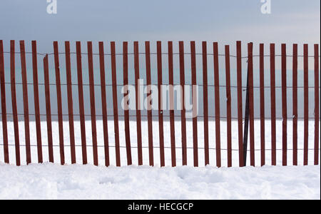 Fence on a lake Stock Photo